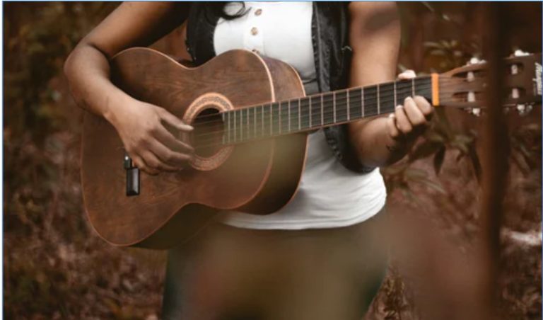 girl playing guitar